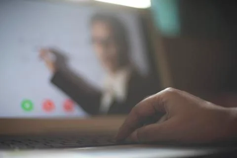Hands on laptop keypad while attending online classes in home isolation due t Stock Photos