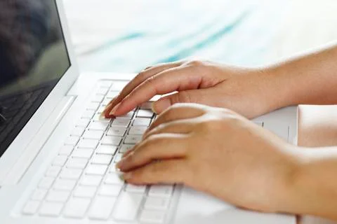 Hands on a laptop Stock Photos