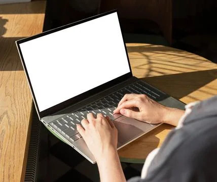 Hands at laptop with screen mockup, empty blank clean display mock upp Stock Photos