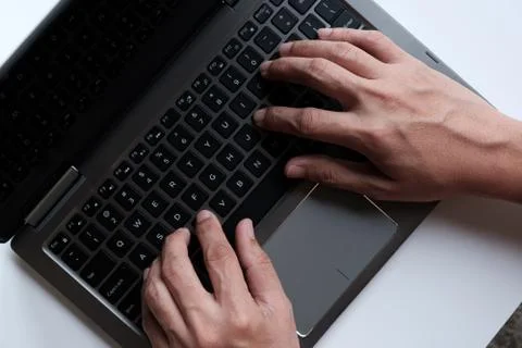Hands with laptop typing Stock Photos