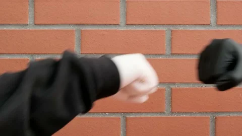 Hands in latex gloves Say Hello with a Fist (closed hands) Bump during corona Stock-Footage 138945548