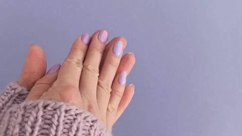 Hands with lavender with a beautiful manicure Stock Footage 236395288
