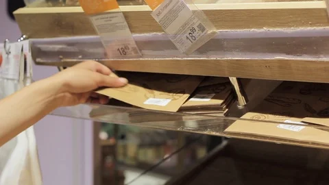 Hands lay bread in cardboard packaging Stock Footage 91684132