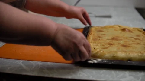 Hands lay out potato pie Stock Footage 120295873