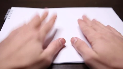 Hands lay on a white sheet of paper. Shows hand gestures Stock Footage 120427250