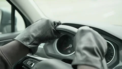 Hands in leather gloves on the steering wheel of a car. The driver is nervous. Stock Footage 300710487