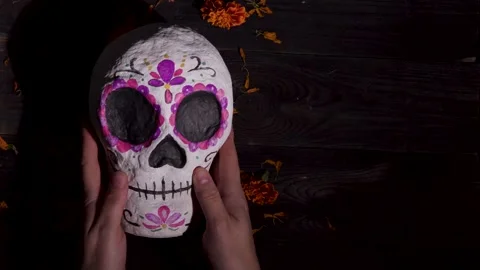 Hands Lift and Display Decorative Sugar Skull Calavera Mask for Day of the Stock Footage 343544425
