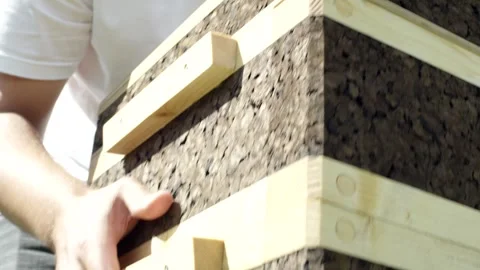 Hands Lifting Cork Hive Body by Pine Grip Rails, Indoor Workshop, Close Up Видео 341295999