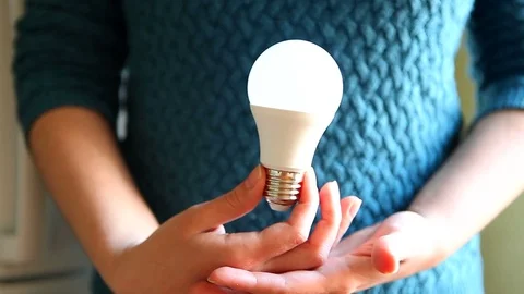 Hands with light bulb, idea or ecology concept 動画素材 76375604