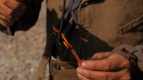 Hands light the fuse - stick of dynamite - Western Transcontinental RailRoad Stock Footage 103812278