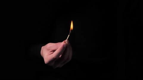Hands light a match in the dark Stock Footage 152479274