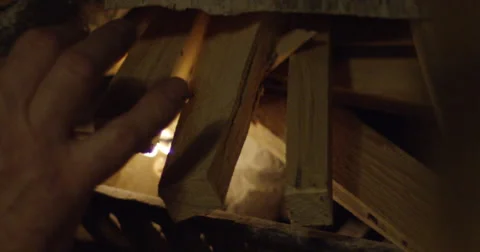 Hands lighting a fire Stock Footage 56919219