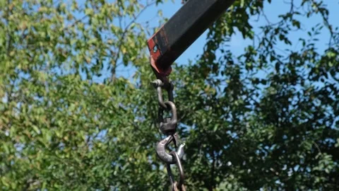 Hands of a loader or worker in gloves, loading, hooking a crane hook for loading Stock Footage 312973920