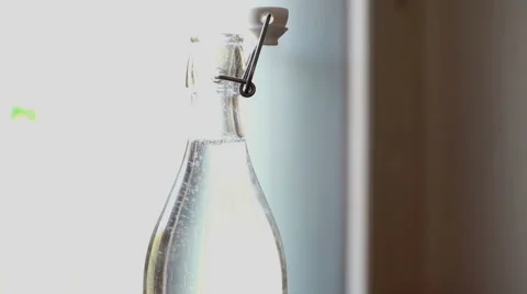 Hands locking a bottle of sparkling water, indoor Stock-Footage 56375042