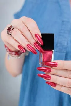 Hands with long nails and red nail polish 스톡 사진