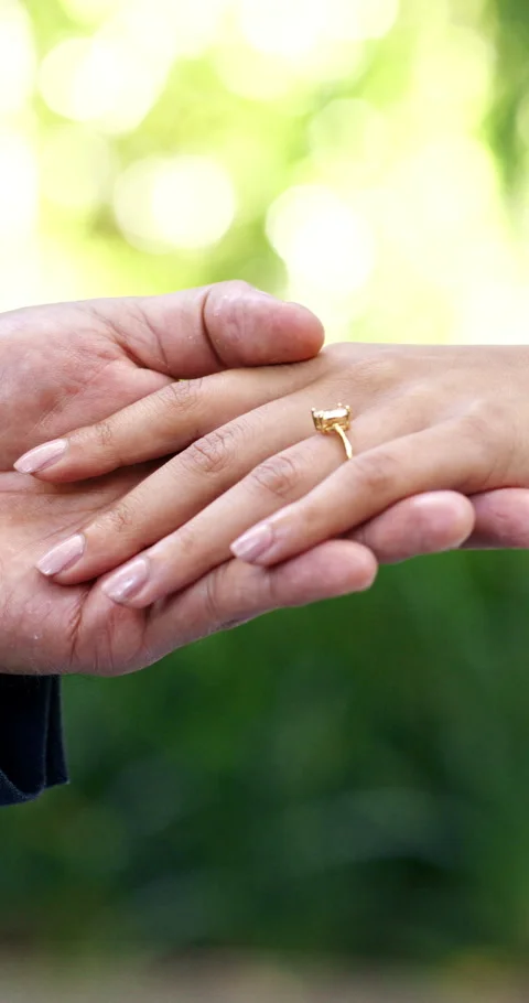Hands, love and wedding ring with couple, marriage and bonding together with Stock Footage 336653749