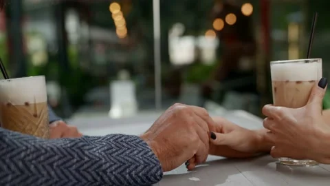 Hands of lovers during date in coffee shop, closeup view, romantic and love Stock Footage 163356798