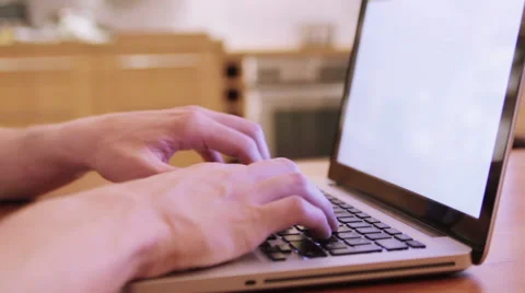 Hands on an Macbook on a wooden table Stock Footage 40358824