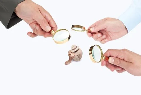 Hands with magnifier glasses looking, studying or selecting a person Stock Photos