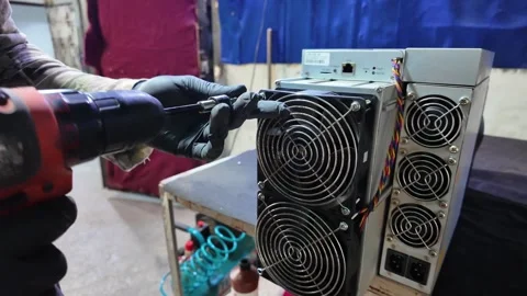 Hands-On Maintenance: Technician Services High-Performance ASIC Crypto Miner Stock Footage 321402451