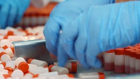 Hands make up bottles of liquid for chemical production Stock Footage 101013787