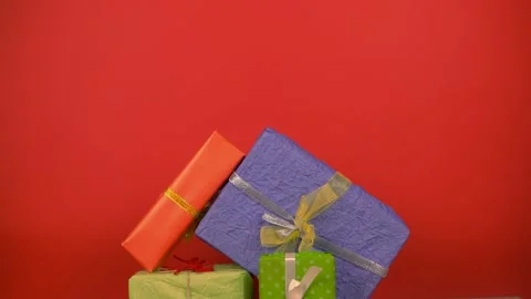 Hands make a Christmas tree shape from gifts, stack gifts, New Year celebration Stock Footage 140650911