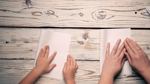 Hands make a paper airplane Stock Footage 81403017