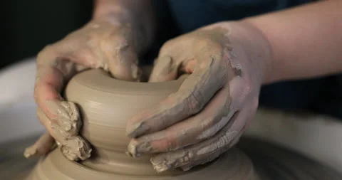 Hands making ceramics with clay on pottery wheel Stock Footage 140767087