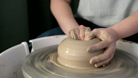 Hands making ceramics with clay on pottery wheel Stock Footage 140767438