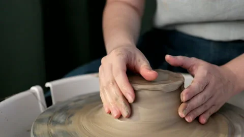 Hands making ceramics with clay on pottery wheel Stock Footage 140767526