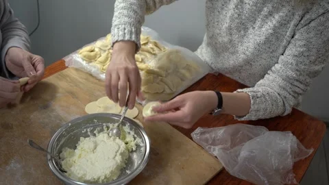 Hands making cheese dumplings. Cook dough food at home. Stock Footage 337785367