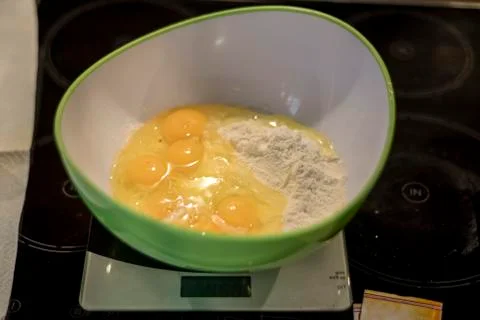 Hands making duff pastry egg in bowl to make fresh waffles Stock Photos