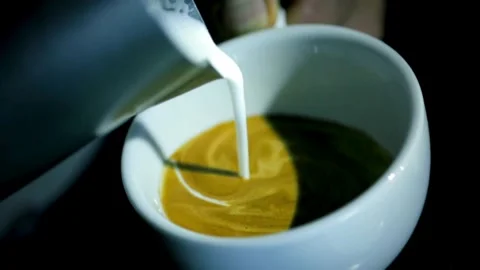 Hands making latte art on Green tea latte. 動画素材 334648405