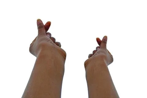 Hands Making a Mini Heart Gesture on a White Background Stock Photos