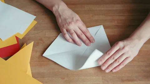 Hands making origami ship with white paper , time lapse Stock Footage 35104674