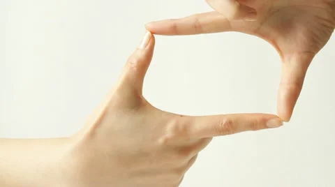 Hands making picture frame Stock Footage
