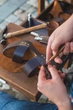Hands making shoes Stock Photos