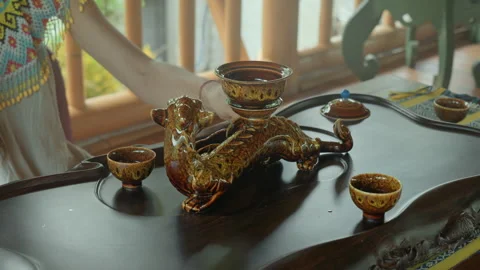 The hands making a tea ceremoy on the wooden table before start of the soun.. Stock Footage 340117833