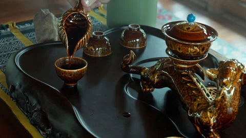 The hands making a tea ceremoy on the wooden table before start of the soun.. Stock Footage 341010205