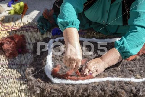 Hands making traditional wool felt Stock Photos