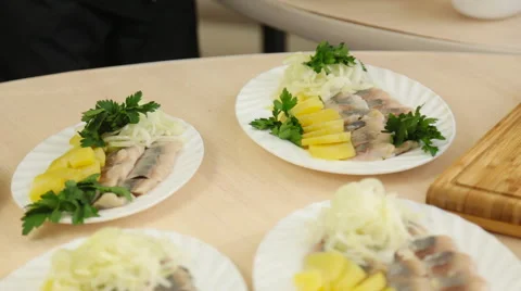 Hands of male chef serving salad on plate Stock Footage 60051885