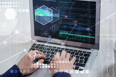 The hands of a male programmer working in an office. Encoding. Stock Photos