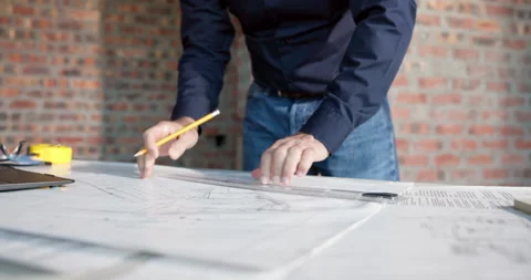 Hands, man and engineer writing with blueprint, drawing and sketch for building Stock Footage 337537914