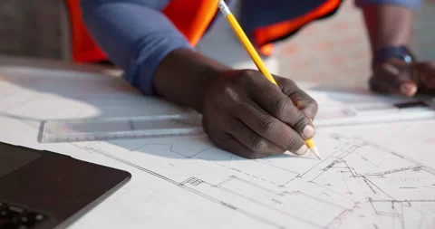 Hands, man and engineer writing with blueprint, drawing and document for Stock Footage 337547274