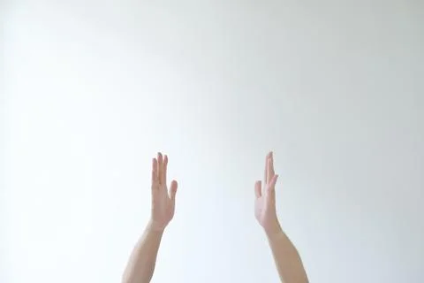 The hands of man are going to pose pray or adore something Stock Photos