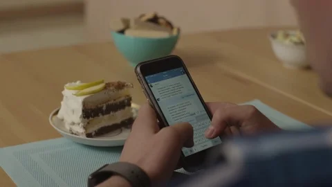 Hands of a man are writing a sms on a smartphone. Man write a message on a Stock Footage