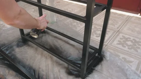 In the hands of a man a balloon with black paint Vidéo 145182596