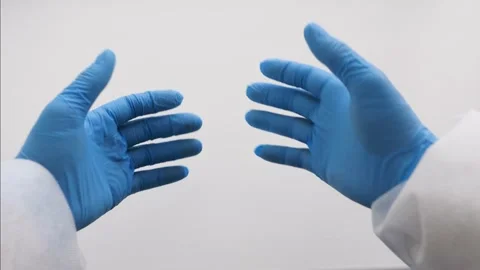 Hands of a man in blue gloves show like. Stock Footage 130439124