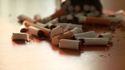 Hands of a man breaking a cigarette in two halves with hand. Stop smoking con Stock Footage 108252470