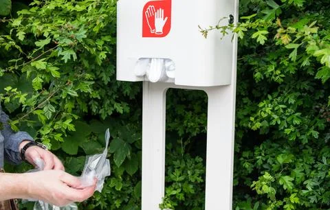 Hands of the man in cellophane gloves. Stock Photos